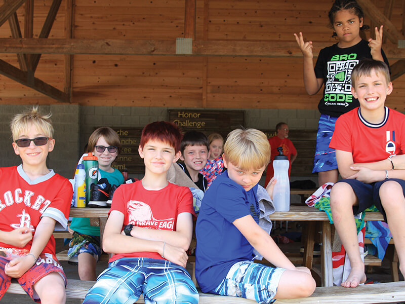 Group of smiling boys at camp