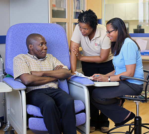 Patient and IHTC staff talking